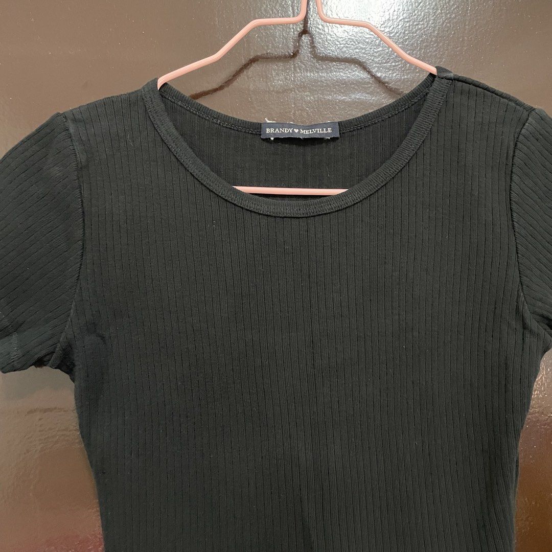 Brandy Melville Black Ribbed Tee (Category: Shirts) located in Pasay City. Submitted by lovedbyzea (Listing ID 1467528254, Image 2). Description: - Brand: Brandy Melville - Color: Black in actual, not faded!! - Style: Ribbed short sleeve top with classic scoop neckline - Fit: Stretchy fabric, standard cropped length, fits true to standard Brandy sizing - Condition/Vibe: Super versatile basic for everyday fits.