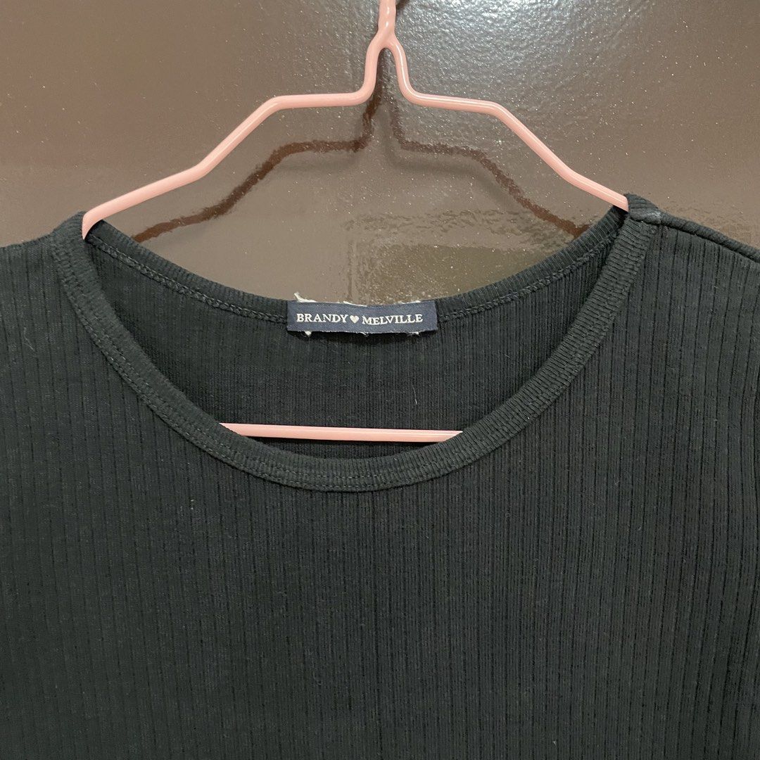 Brandy Melville Black Ribbed Tee (Category: Shirts) located in Pasay City. Submitted by lovedbyzea (Listing ID 1467528254, Image 3). Description: - Brand: Brandy Melville - Color: Black in actual, not faded!! - Style: Ribbed short sleeve top with classic scoop neckline - Fit: Stretchy fabric, standard cropped length, fits true to standard Brandy sizing - Condition/Vibe: Super versatile basic for everyday fits.