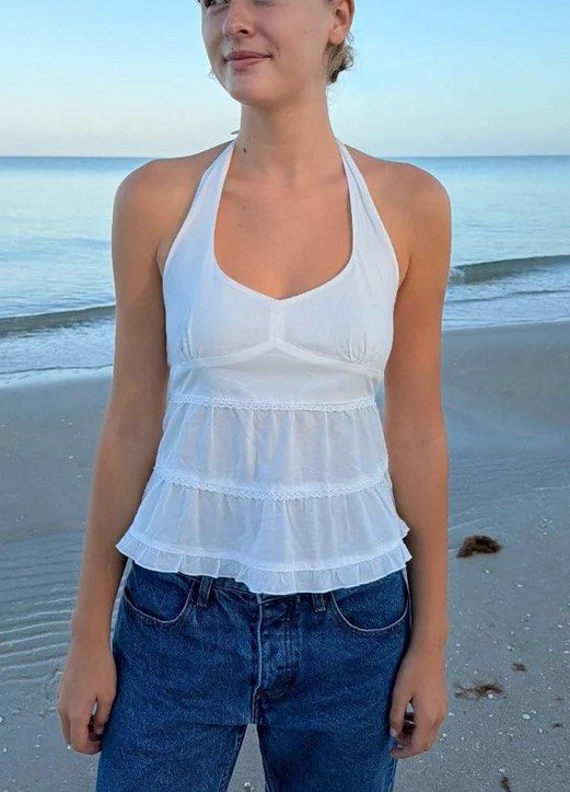 Brandy Melville Edith Halter Top (Category: Sleeveless) located in Manila. Submitted by c.mnl (Listing ID 1467401686, Image 1). Description: Bought in HK! Soft sheer cotton halter top featuring layered embroidered seams. Fabrics: 100% cotton Measurements: 19” (50cm) length, 13” (35cm) bust.