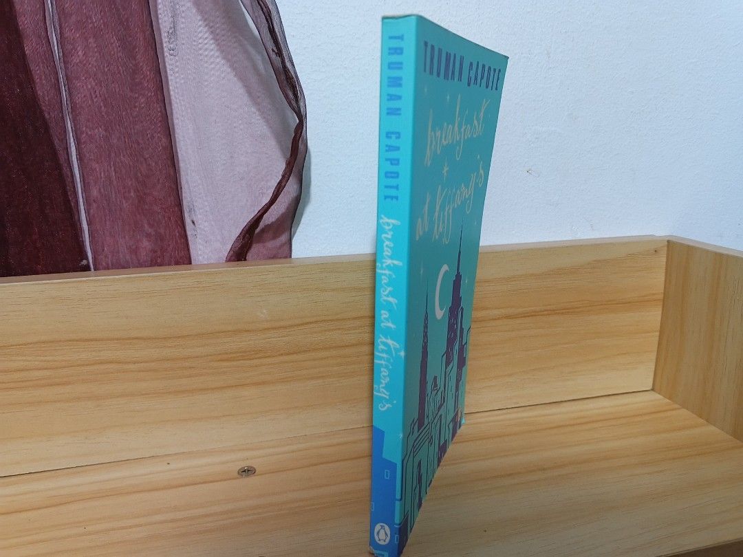 Breakfast at Tiffany's by Truman Capote (Penguin Classics) (Category: Storybooks) located in Cavite. Submitted by frannyglasstoo (Listing ID 1467532941, Image 2). Description: MESSAGE ME FOR MORE PICTURES! Condition: Good MOP: GCASH MOD: J&T (or Lala Express) Payment first basis, reservation is only up to one month. This is my secondary account, I lost my main account, check out my reviews here: https://carousell.app.link/bc9mER4pq1b.