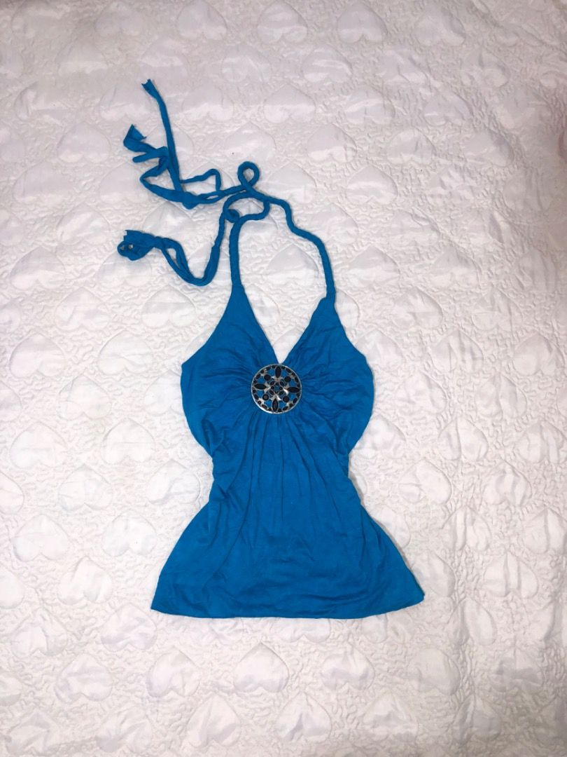 Bright Blue Halter Top With Rhinestone Medallion (Category: Sleeveless) located in Davao. Submitted by christ07_fox (Listing ID 1467571025, Image 1). Description: - Color: Vibrant blue - Design: Sleeveless halter style with braided self-tie neck straps - Centerpiece: Large ornate circular medallion with dark stones and silver metalwork - Fit: Body-hugging silhouette with flattering slight ruching - Material: Soft and comfortable stretch fabric - 