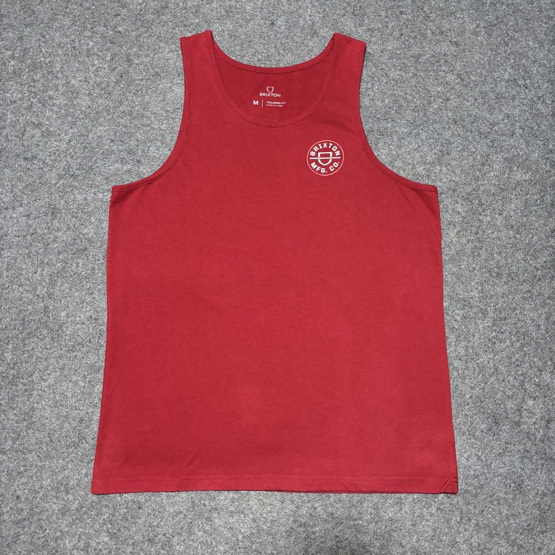 Brixton Red Tailored Fit Tank Top Size M (Category: Tshirts & Polo Shirts ) located in Cebu City. Submitted by andrewvivar29 (Listing ID 1467442439, Image 1). Description: - Brand: Brixton - Color: Rich Red - Size: Medium (Tailored fit) - Design: Small chest logo on front, large graphic on back - Style: Crew neck, sleeveless - Material: 60% Cotton, 40% Polyester (lightweight and comfortable) - Condition: Clean inside and out.