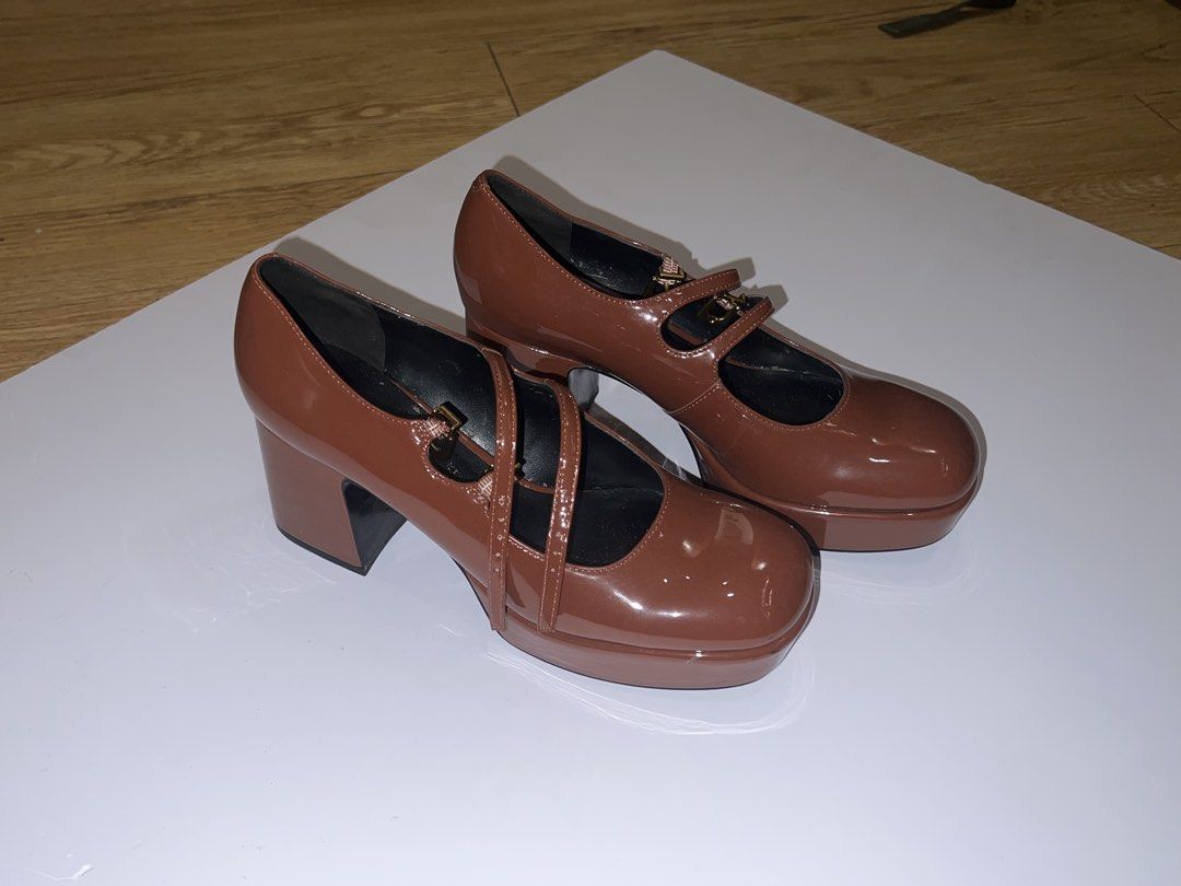 Charles & Keith - Brown Double Strap Platform Mary Jane Heels (Category: Heels) located in Pasig City. Submitted by moiclaire (Listing ID 1467512689, Image 2). Description: - Authentic Charles & Keith - Glossy brown finish - Chunky block heels with front platform for extra comfort and height - Double strap design with secure buckle closures - Stylish gold hardware accents - Trendy rounded square toe shape - rfs: decluttering, no longer my style -