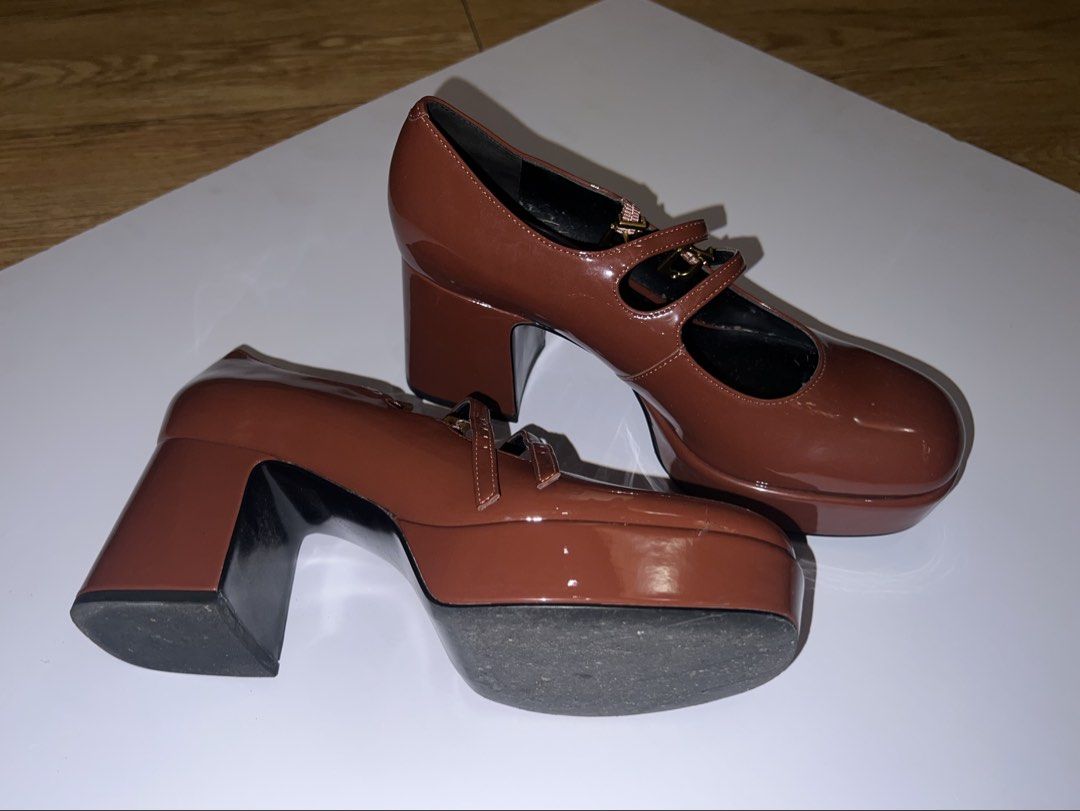 Charles & Keith - Brown Double Strap Platform Mary Jane Heels (Category: Heels) located in Pasig City. Submitted by moiclaire (Listing ID 1467512689, Image 3). Description: - Authentic Charles & Keith - Glossy brown finish - Chunky block heels with front platform for extra comfort and height - Double strap design with secure buckle closures - Stylish gold hardware accents - Trendy rounded square toe shape - rfs: decluttering, no longer my style -