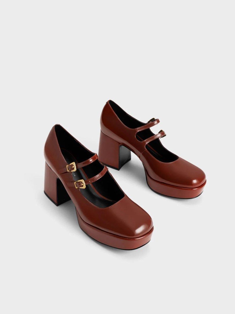 Charles & Keith - Brown Double Strap Platform Mary Jane Heels (Category: Heels) located in Pasig City. Submitted by moiclaire (Listing ID 1467512689, Image 1). Description: - Authentic Charles & Keith - Glossy brown finish - Chunky block heels with front platform for extra comfort and height - Double strap design with secure buckle closures - Stylish gold hardware accents - Trendy rounded square toe shape - rfs: decluttering, no longer my style -