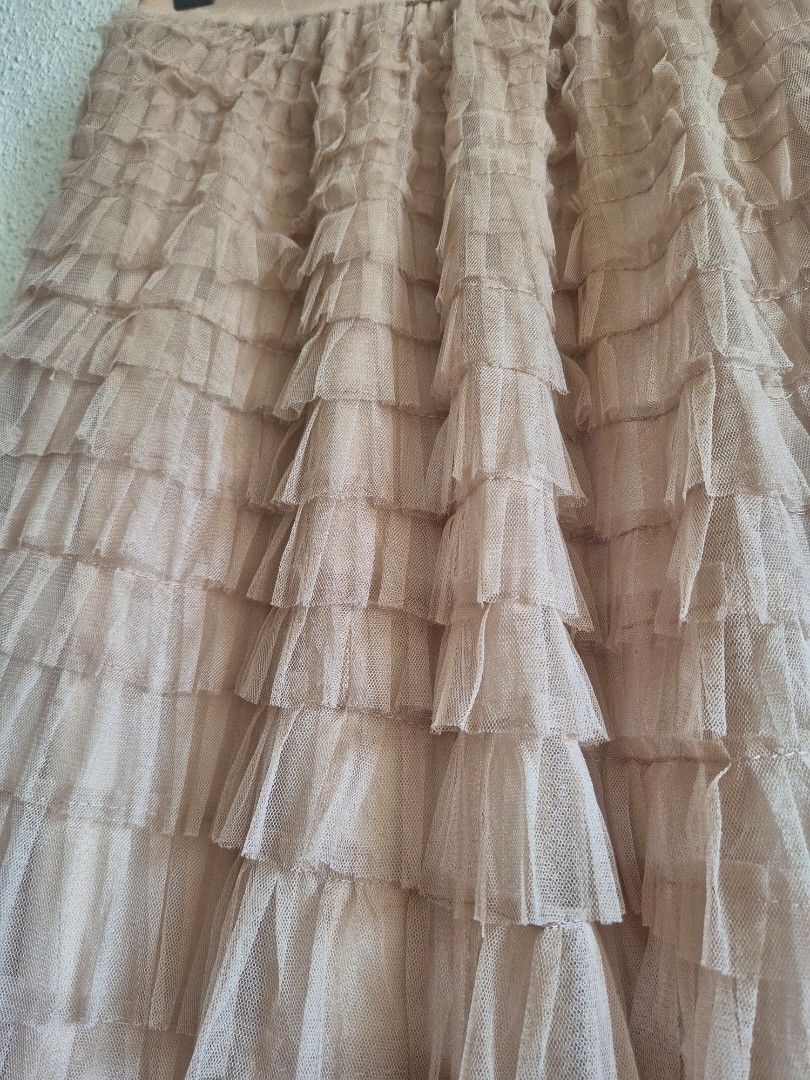 Brown Layered Tutu Skirt Ruffled Tulle (Category: Skirts) located in Manila. Submitted by belovedbyjess (Listing ID 1467408322, Image 3). Description: - Color: Brown - Design: Layered tutu with tiered ruffles and fluffy tulle fabric - Comfort: Stretchy elastic waistband - Coverage: Fully lined and not see-through - Versatility: Great for casual wear or dressing up.