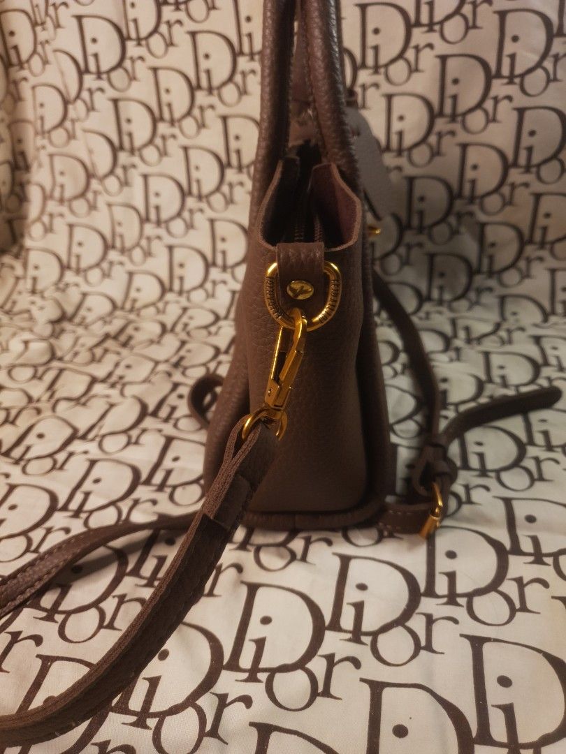 Brown purse bag with sling (Category: Purses & Pouches) located in San Fernando. Submitted by retro.district. (Listing ID 1467524230, Image 3). Description: Decluttering bags RFS: MOM NEEDS TO FREE UP SOME SPACE IN HER CLOSET - Random brown purse with sling - Condition: Excellent (Rank A) - No issue - Color Rate: 9.5/10.