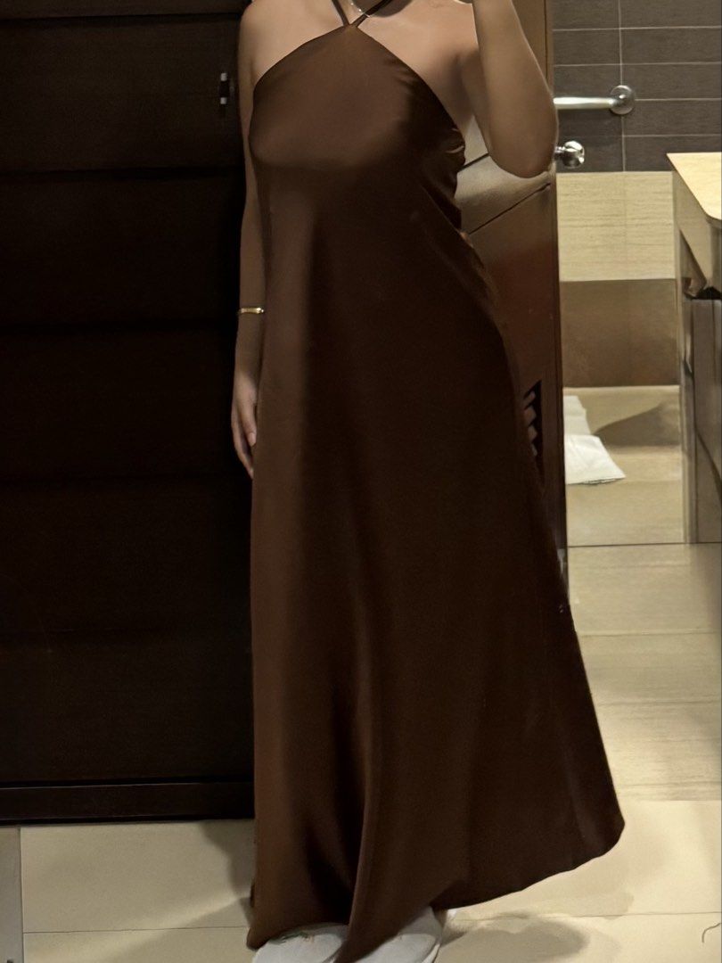 Brown Satin Halter Evening Dress (Category: Dresses) located in Makati City. Submitted by alyssa.mm (Listing ID 1467379711, Image 2). Description: Perfect for Photoshoots, Graduation, Weddings, Birthdays, and other special events! 💃🪩 - Can fit S-M because of its flowy fabric! FOR SALE: P2500 (FOR RENT) Dress Rental Guidelines • Long Dresses: P450 for 3 days • Security Deposit: P1,000 (fully refundable upon safe return without damage) • Shipping