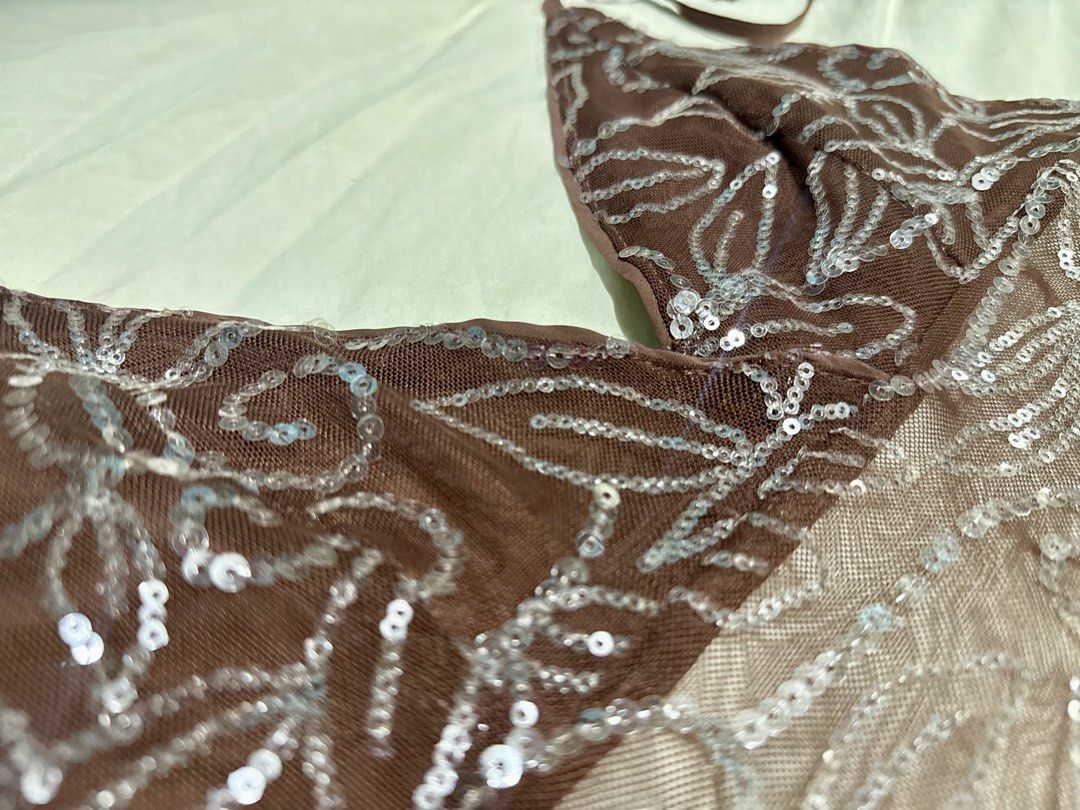 Brown Sequin Halter Mesh Top (Category: Sleeveless) located in Manila. Submitted by deanise_jil (Listing ID 1467489872, Image 2). Description: Vintage Y2K Beaded Sequin Halter Top Backless Size - S-Semi M Issue : loose thread on string only. Tags : Beaded Halter Top Backless/ Sequins / Aesthetic / Brown / Neutral / Halter / Cami / Outfit /Silver / Stylish / Brown.