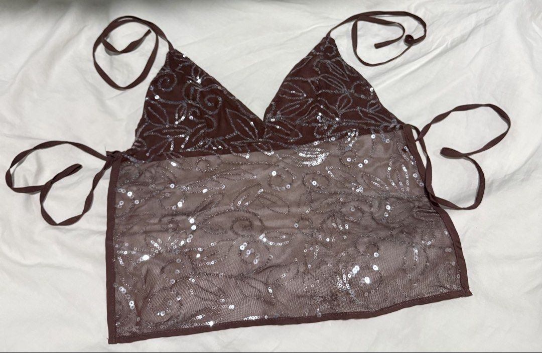 Brown Sequin Halter Mesh Top (Category: Sleeveless) located in Manila. Submitted by deanise_jil (Listing ID 1467489872, Image 1). Description: Vintage Y2K Beaded Sequin Halter Top Backless Size - S-Semi M Issue : loose thread on string only. Tags : Beaded Halter Top Backless/ Sequins / Aesthetic / Brown / Neutral / Halter / Cami / Outfit /Silver / Stylish / Brown.