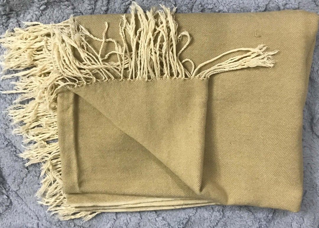 Brown Woven Throw Blanket with Fringe (Category: Bedding & Towels) located in Imus. Submitted by stop_shop7 (Listing ID 1467442386, Image 1). Description: - Color: Brownwith cream-colored twisted fringe - Material: Soft woven textured fabric - Styling: Warm earth tone, great for couches or beds -washable stain.