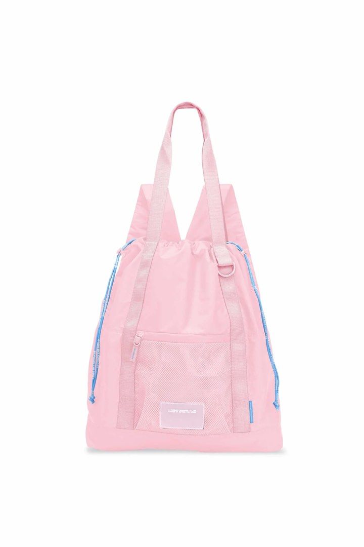 BTV Parapack 002 in light pink (Category: Backpacks) located in Manila. Submitted by nicoleaaa (Listing ID 1467448926, Image 1). Description: - Brand: Beyond The Vines - Color: Light pink nylon with blue cord details (i just have bad lighting at home) - Condition: with original store tags attached; used twice - Features: Dual top carry handles, adjustable shoulder straps, front mesh pocket with branded patch - Closure & Storage: Drawstring and zi