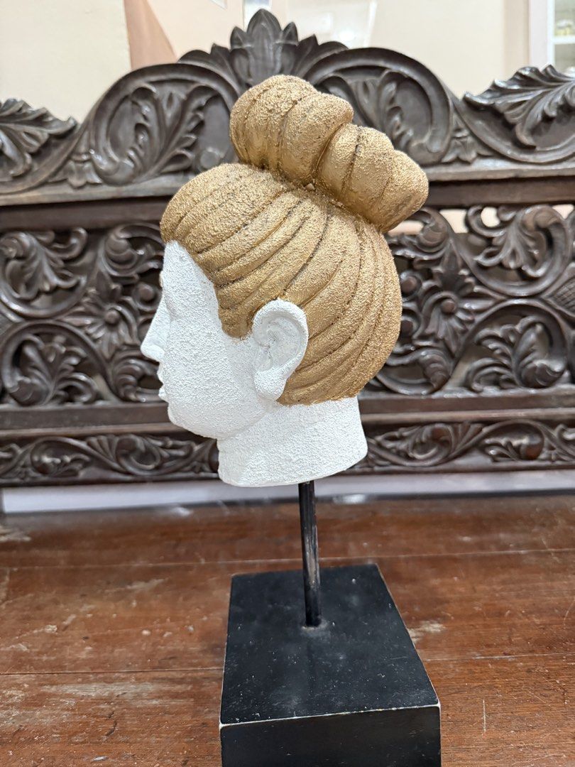 Buddha Head Sculpture Decorative Figurine on Stand (Category: Religious Items) located in Manila. Submitted by chestercor71092 (Listing ID 1467431338, Image 2). Description: White Buddha head sculpture with textured gold hair and bun. Mounted on a black metal rod and square base. Calm expression, detailed ear and facial features. Good accent piece for a shelf, desk, or entryway table. Neutral tones fit right into most living room or bedroom setup