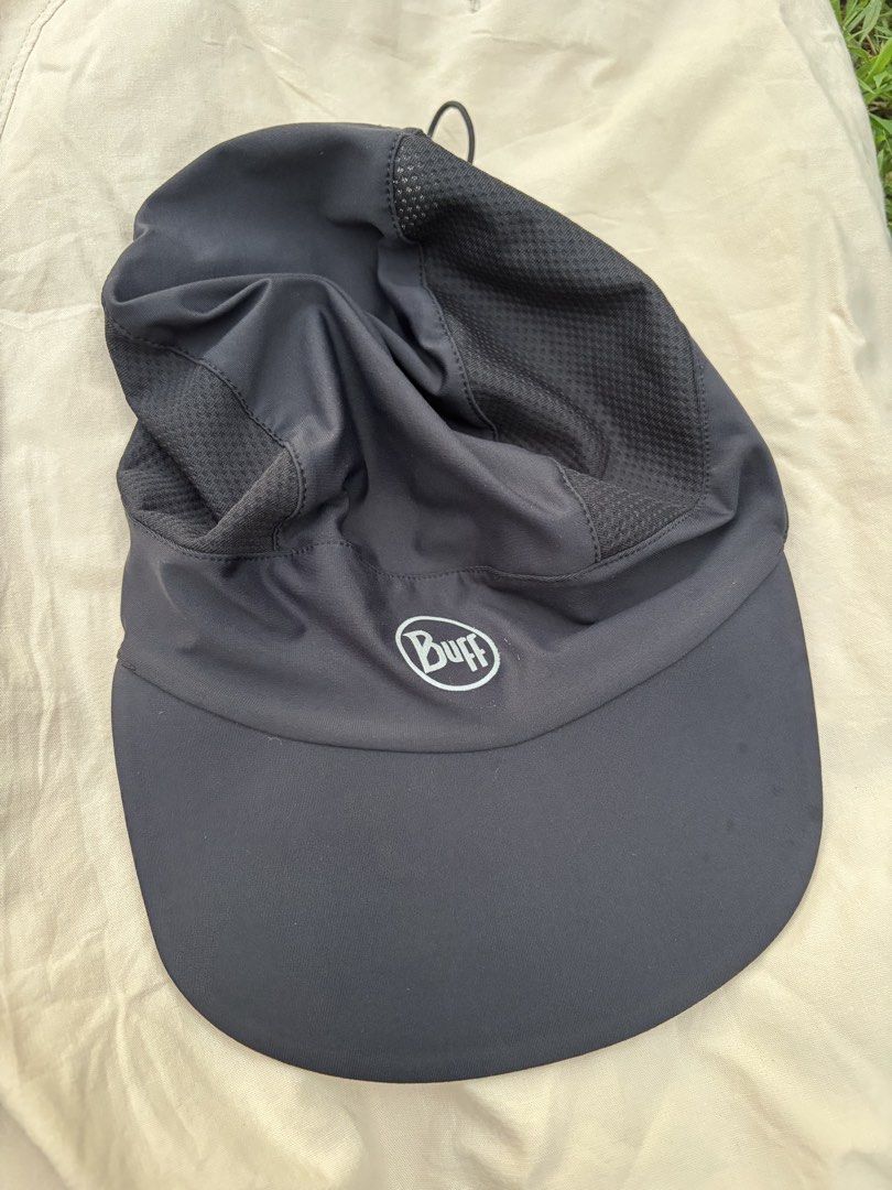 Buff Black Running Cap With Ponytail Hole (Category: Activewear) located in Iloilo. Submitted by oddforest.c9c7d5 (Listing ID 1467377057, Image 1). Description: - Brand: Buff - Color: Solid black - Condition: Excellent, clean with no stains or loose threads - Breathable mesh side panels to keep you cool - Adjustable bungee cord for a custom fit - Convenient ponytail opening - Ideal for outdoor runs and training sessions.