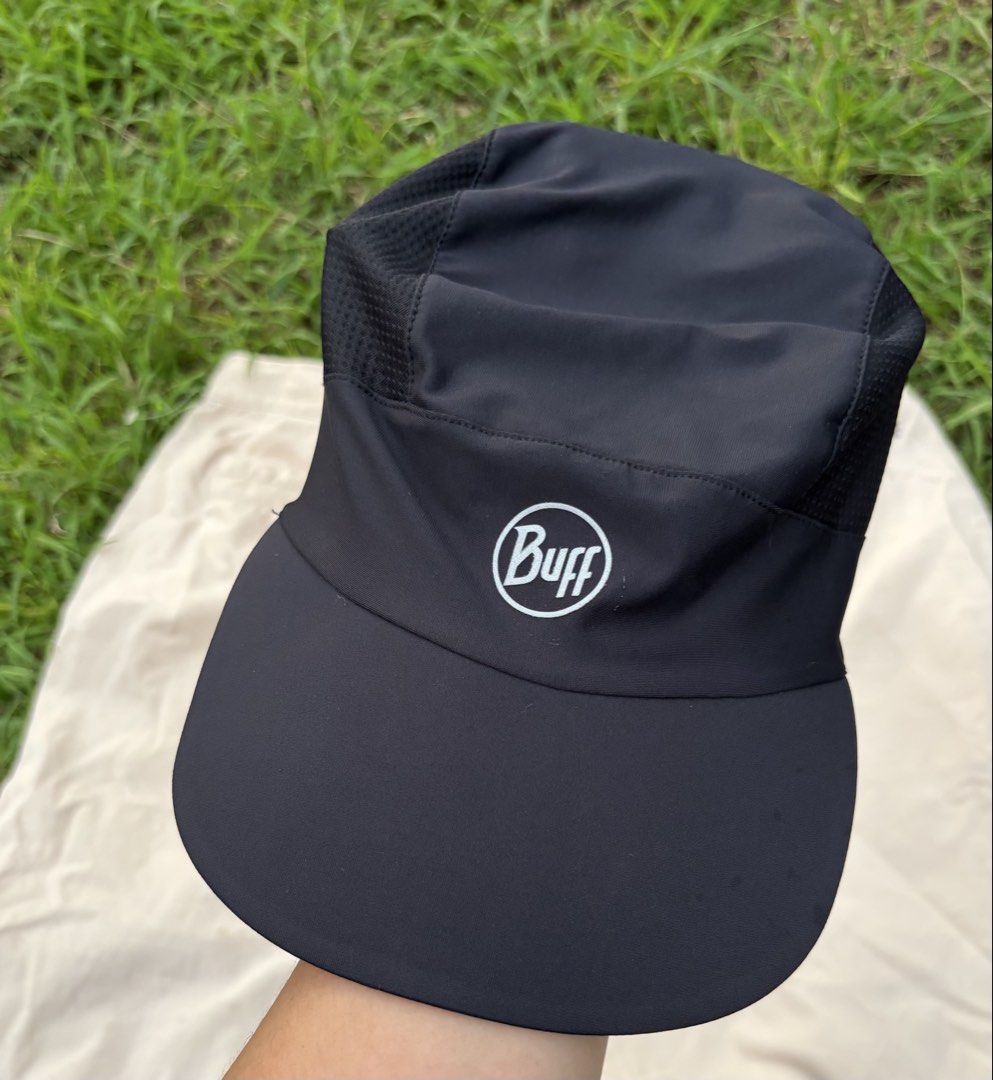 Buff Black Running Cap With Ponytail Hole (Category: Activewear) located in Iloilo. Submitted by oddforest.c9c7d5 (Listing ID 1467377057, Image 2). Description: - Brand: Buff - Color: Solid black - Condition: Excellent, clean with no stains or loose threads - Breathable mesh side panels to keep you cool - Adjustable bungee cord for a custom fit - Convenient ponytail opening - Ideal for outdoor runs and training sessions.