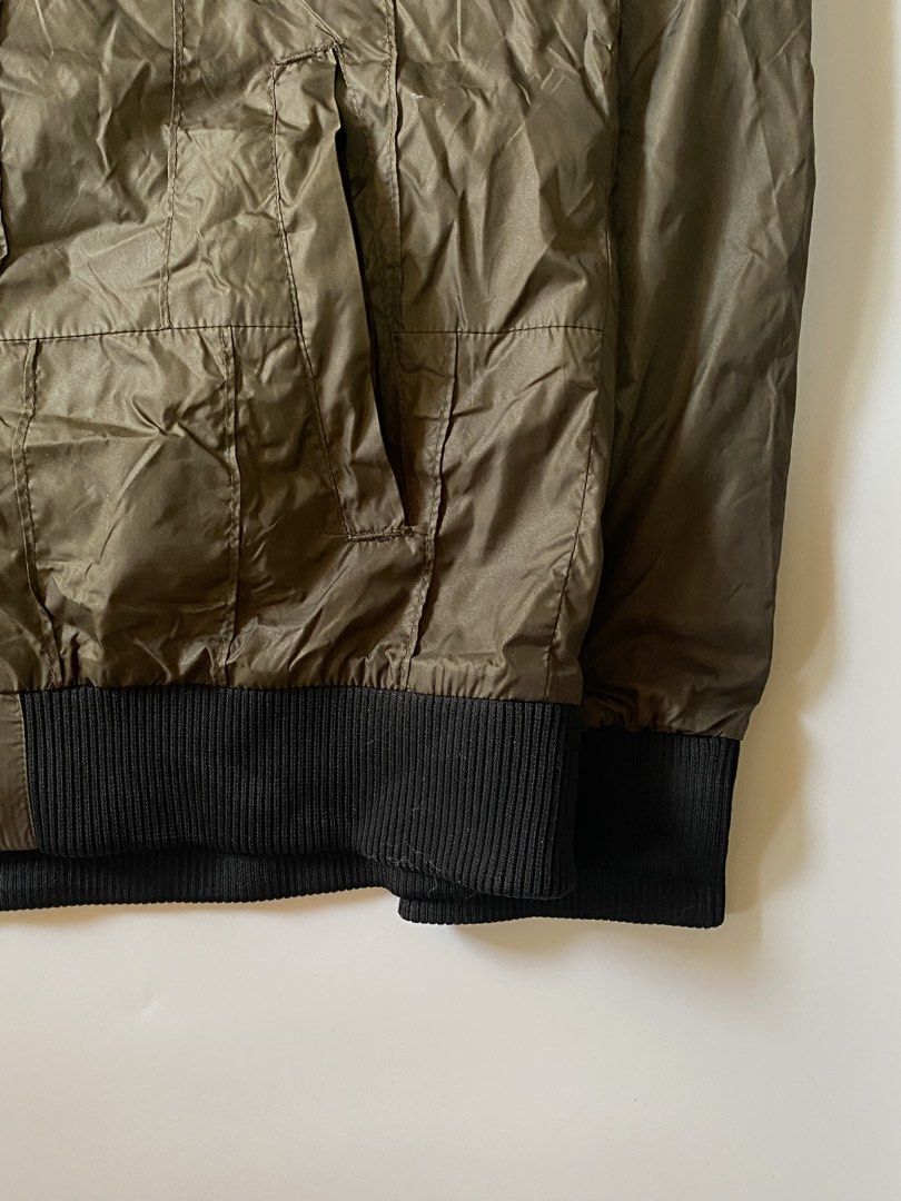 Burberry Olive Zip Up Nylon Bomber Jacket (Category: Coats, Jackets and Outerwear) located in Manila. Submitted by finofindthisart (Listing ID 1467404546, Image 3). Description: Length 26 Width 22 Hem Measured it by inches Issue: broken puller but still working This is a pre-loved/thrifted items and may show minor signs of issue due to its vintage nature. Kindly manage expectations. No refunds or exchanges will be accepted. 📍Pasay City DM for in