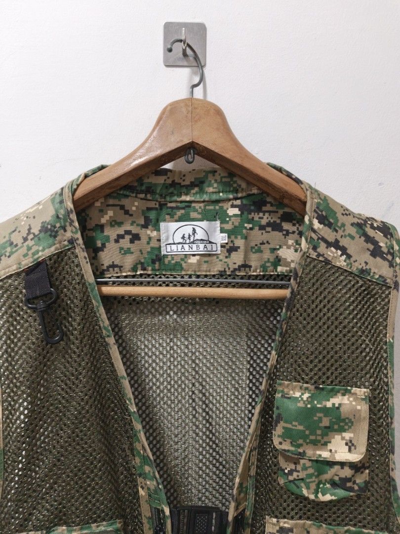 Camouflage Utility Vest (Category: Vests) located in Manila. Submitted by aristothrift (Listing ID 1467590596, Image 2). Description: 2xl on tag Dimes: Chest - 17 Pit to pit - 23 Length - 25 Excellent Condition Brand: Lianbai Location: Antipolo Mode of payment: Gcash/BPI Shipment: J&T or Lalamove.