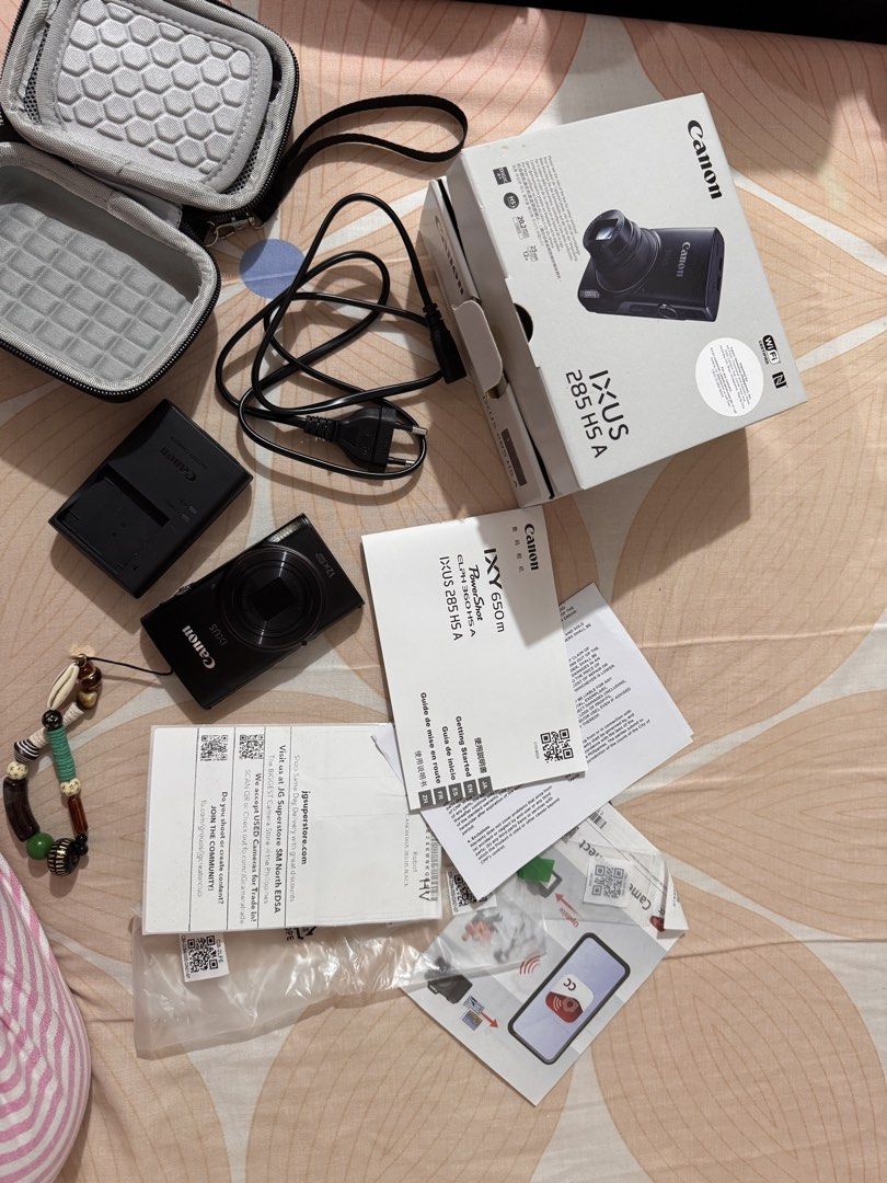 Canon IXUS 285 HS Digital Camera Black (Category: Cameras) located in Taguig. Submitted by slnnvs (Listing ID 1467363443, Image 1). Description: - Item: Canon IXUS 285 HS - Color: Black - Condition: Like new, fully tested and working perfectly - Purchase Info: Bought from JG Superstore - 🍊app (Order completed: August 26, 2026) - Original Price: ₱22,998 - Inclusions: Complete with original box, charger, cables, and manuals - Freebies: Includes a 