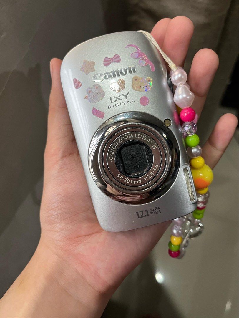 Canon IXY Digital 510 IS (Category: Cameras) located in Quezon City. Submitted by mariafayee (Listing ID 1467365473, Image 1). Description: - Brand/Model: Canon IXY Digital camera (Silver) - Resolution: 12.1 Megapixels - Lens: 5.0-20.0mm 1:2.8-5.8 zoom lens - Stickers and strap are not included - 8/10 cosmetics, minor scratches - Comes with battery and charger .