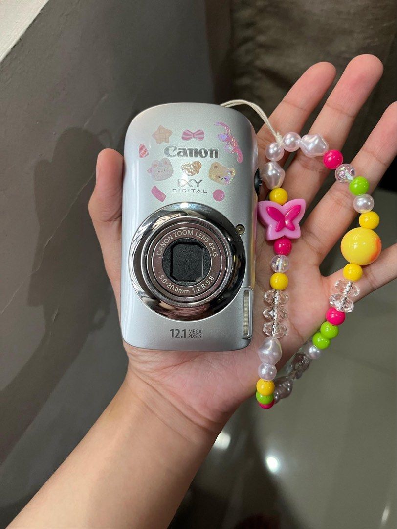 Canon IXY Digital 510 IS (Category: Cameras) located in Quezon City. Submitted by mariafayee (Listing ID 1467365473, Image 2). Description: - Brand/Model: Canon IXY Digital camera (Silver) - Resolution: 12.1 Megapixels - Lens: 5.0-20.0mm 1:2.8-5.8 zoom lens - Stickers and strap are not included - 8/10 cosmetics, minor scratches - Comes with battery and charger .