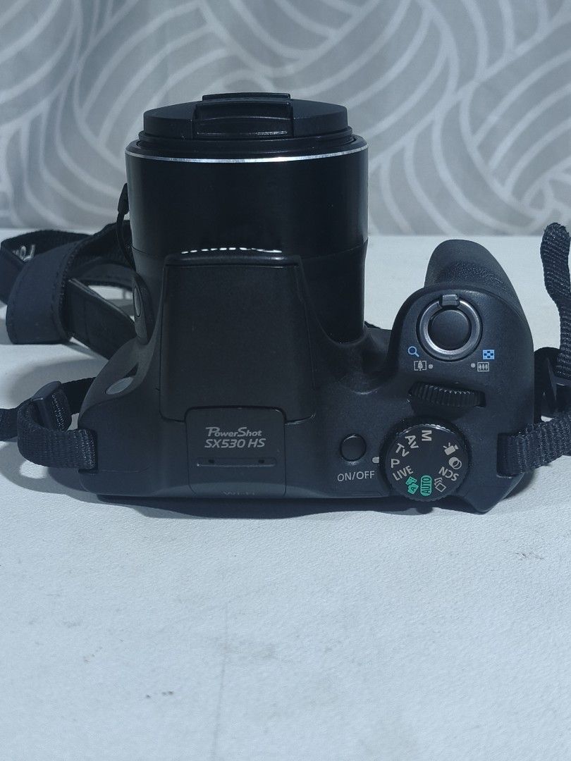 Canon PowerShot SX530 HS Digital Camera (Category: Cameras) located in Quezon City. Submitted by boldearth_27b1b3 (Listing ID 1467582544, Image 3). Description: - Model: Canon PowerShot SX530 HS Digital Camera (Black) - Zoom: Powerful 50x optical zoom, ideal for travel, sports, and wildlife - Connectivity: Built-in Wi-Fi for easy photo sharing - Condition: Fully functional, powers on properly, shows minor surface wear from normal handling - Inclu