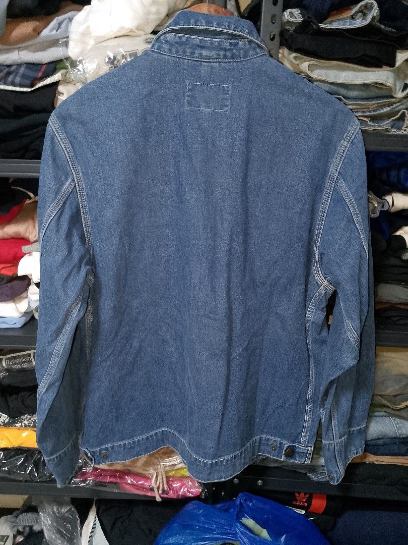 Carhartt WIP Denim Jacket Blue (Category: Coats, Jackets and Outerwear) located in Manila. Submitted by mjthrifted_second (Listing ID 1467464695, Image 2). Description: - Brand: Carhartt WIP - Color: Mid blue wash -Dimes: 22/27 - Closure: Full zip front with branded metallic pull - Pockets: Chest pocket with zipped compartment plus two lower angled welt pockets - Details: Classic Carhartt logo patch, fold-down collar, and button cuffs - Material: