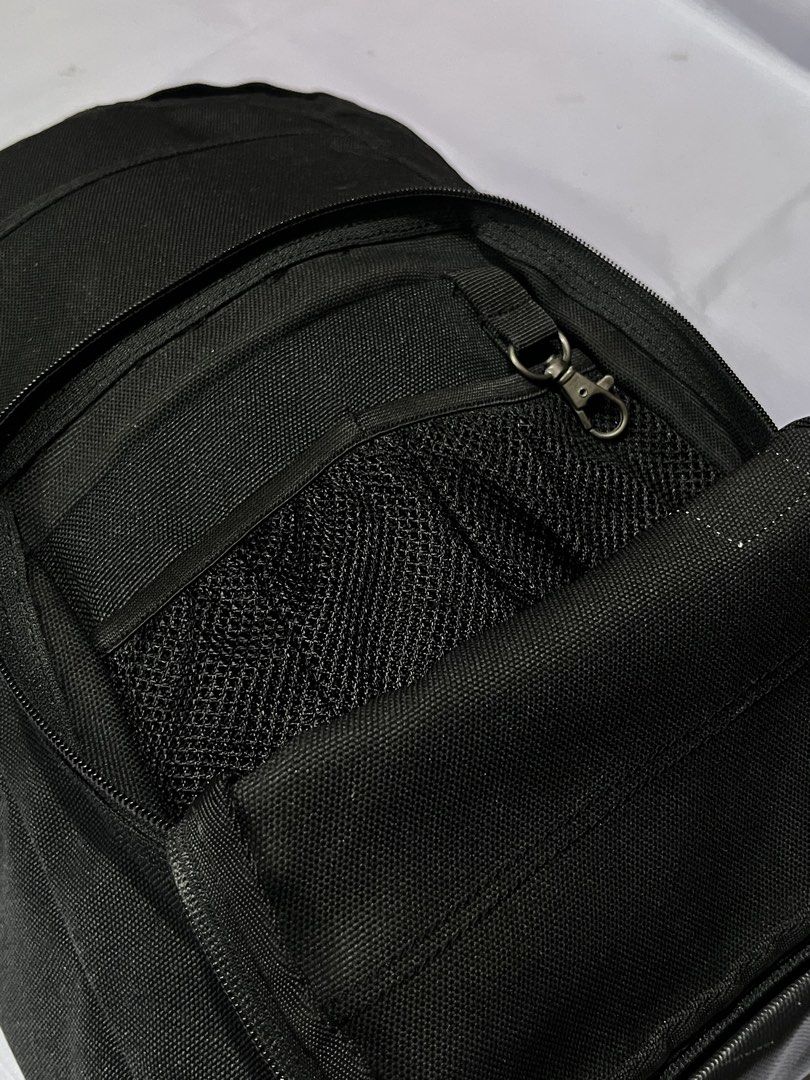 Carousell Carhartt Black Backpack (Category: Backpacks) located in Impasugong. Submitted by luisterpicks (Listing ID 1467485877, Image 3). Description: - Brand: Carhartt - Color: Classic Black - Material: Heavy-duty, durable fabric with iconic logo patch - Front Compartment: Includes a handy mesh pocket and built-in keyring clip - Main Compartment: Features multiple slip pockets and an elastic strap to securely hold a laptop or books - Hardware: 