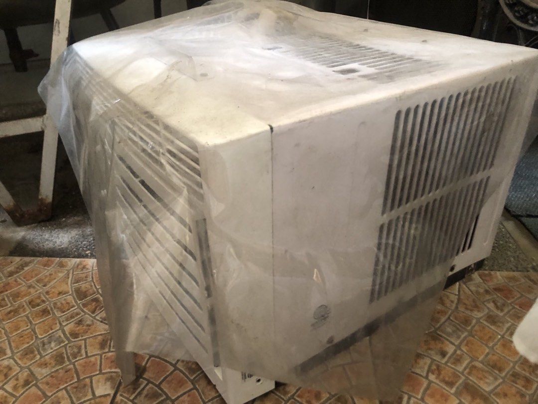 Carrier Optima Window Type Air Conditioner (Category: Air Conditioning and Heating) located in Cainta. Submitted by coolwhale.804534 (Listing ID 1467396423, Image 3). Description: - Brand: Carrier Optima - Type: Window type air conditioner - Color: White casing - Controls: Manual rotary dials for thermostat, timer, and fan speed - Features: Standard vent louvers, heavy-duty cooling performance - Condition: Brand new look, wrapped in protective pl