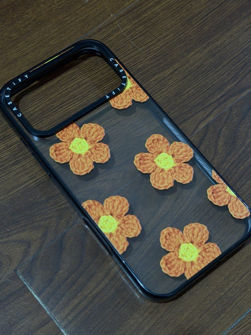 Casetify Flower Case for Iphone 17 Pro Max (Category: Cases & Sleeves) located in Binan City. Submitted by clgruiz (Listing ID 1467456945, Image 1). Description: - Brand/Model: Casetify Flower Case for iPhone 17 Pro Max - Design: Cute orange crochet-style floral pattern on a transparent dark background - Protection: Durable black bumper frame with signature Casetify branding - Condition: Excellent, well-maintained - Meetup Locations: Glorietta 5 