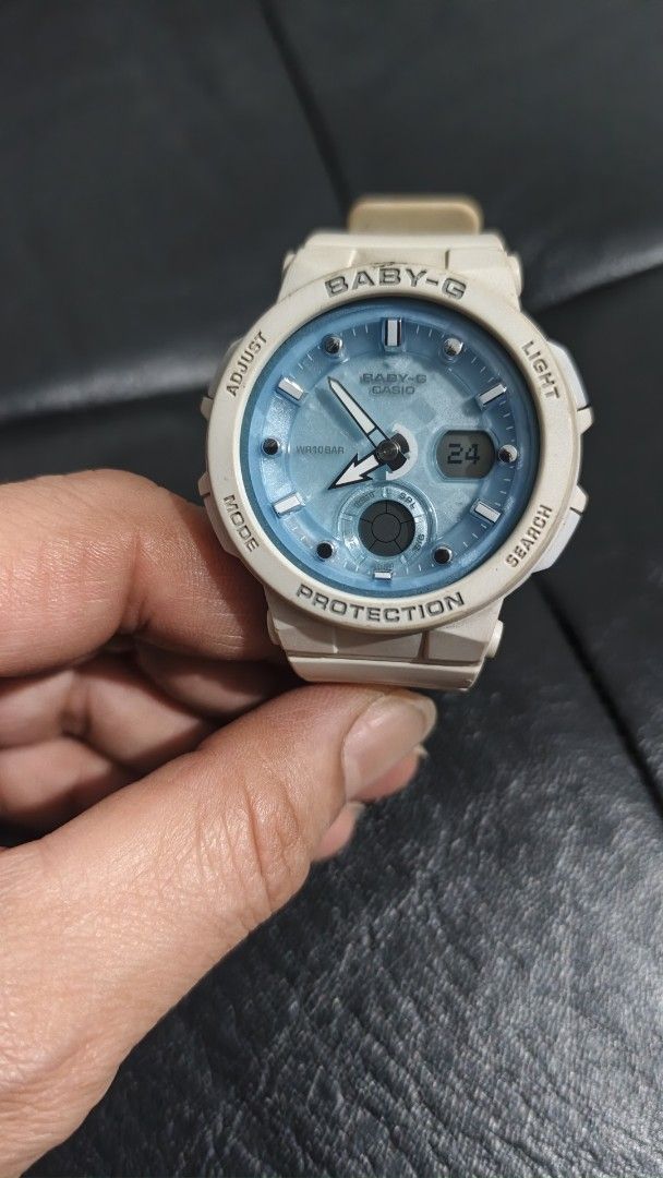 Casio Baby-G Analog-Digital Shock Resistant Watch (Category: Women's Watches) located in San Fernando. Submitted by lacostemoore30 (Listing ID 1467490636, Image 1). Description: - Brand: Casio Baby-G - Color: White resin strap/bezel with a stylish light blue dial face - Display: Analog and digital combination - Water Resistance: Up to 10BAR - Movement: Battery-powered quartz (Module no. 5579) - Condition: Regular wear with some dirt accumulation 
