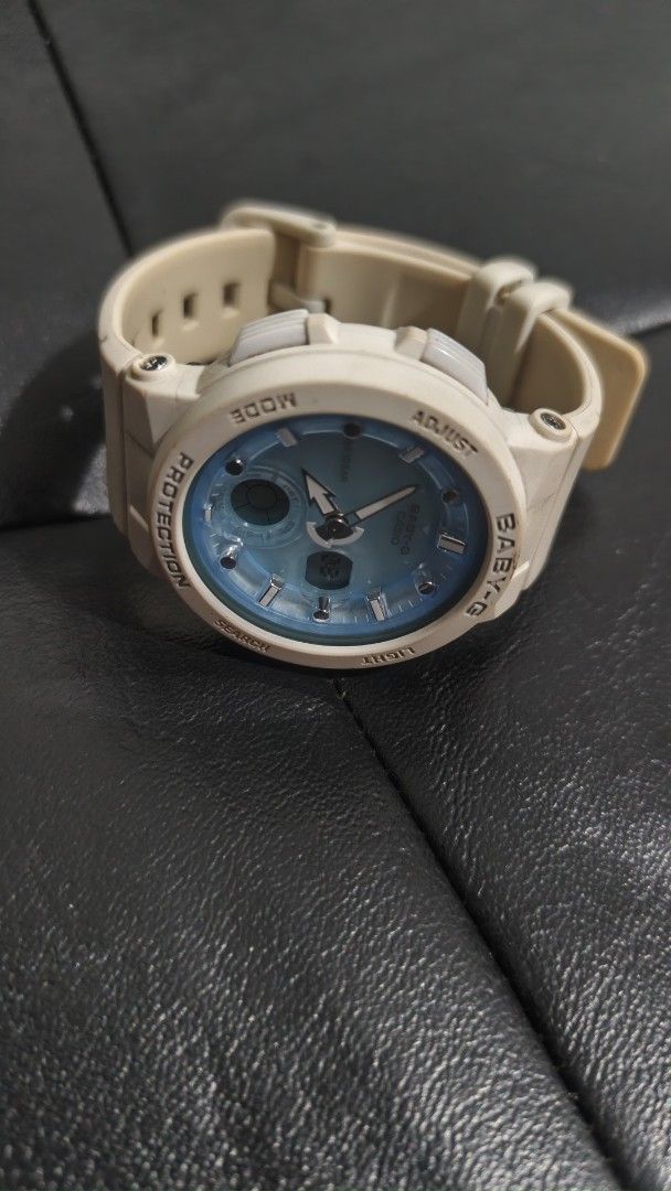 Casio Baby-G Analog-Digital Shock Resistant Watch (Category: Women's Watches) located in San Fernando. Submitted by lacostemoore30 (Listing ID 1467490636, Image 2). Description: - Brand: Casio Baby-G - Color: White resin strap/bezel with a stylish light blue dial face - Display: Analog and digital combination - Water Resistance: Up to 10BAR - Movement: Battery-powered quartz (Module no. 5579) - Condition: Regular wear with some dirt accumulation 