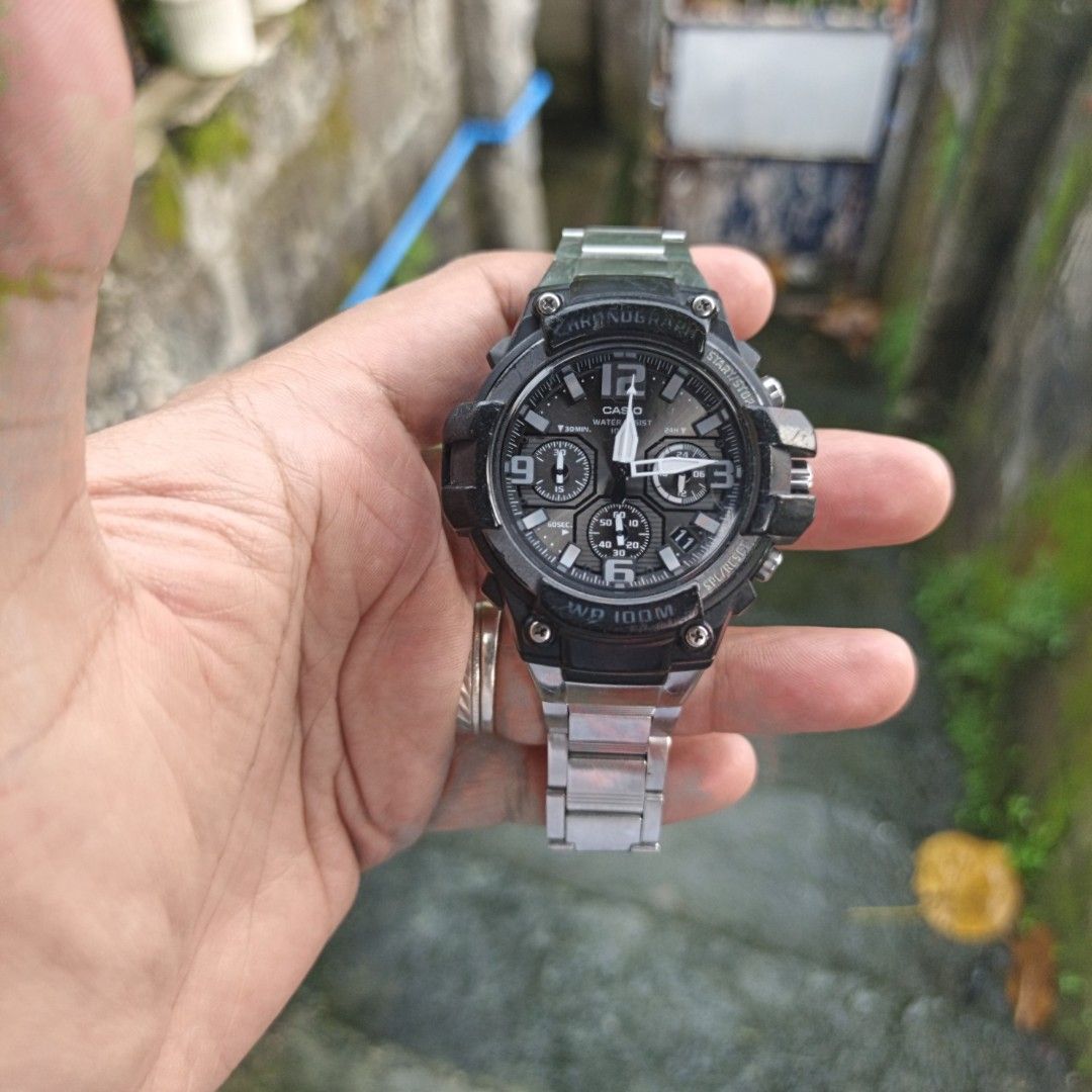 Casio Chronograph Water Resist 100M Wristwatch (Category: Men's Watches) located in Manila. Submitted by narju1234 (Listing ID 1467369501, Image 1). Description: - Brand: Casio Chronograph Watch - Design: Rugged black bezel with textured grey face and multiple sub-dials - Strap: Silver metal bracelet with push-button clasp and Casio branding - Water Resistance: Up to 100 meters - Condition: Runs well and keeps accurate time, with normal signs of 