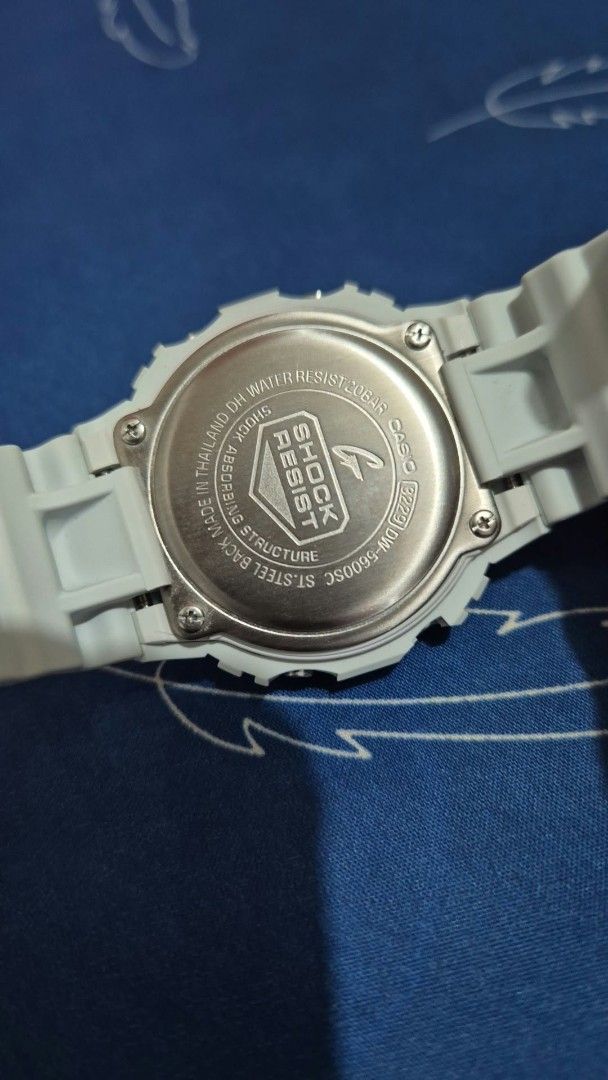 Casio G-Shock DW-5600SC White Digital Watch (Category: Men's Watches) located in Manila. Submitted by jcaseanti (Listing ID 1467446421, Image 3). Description: - Brand: Casio G-Shock - Model: DW-5600SC - Color/Material: White resin square case with clean strap and steel buckle - Movement: Battery-operated quartz - Water Resistance: Up to 20 bar - Inclusions: Original tin container, warranty card, and user manual booklet - Condition: Excellent, wit