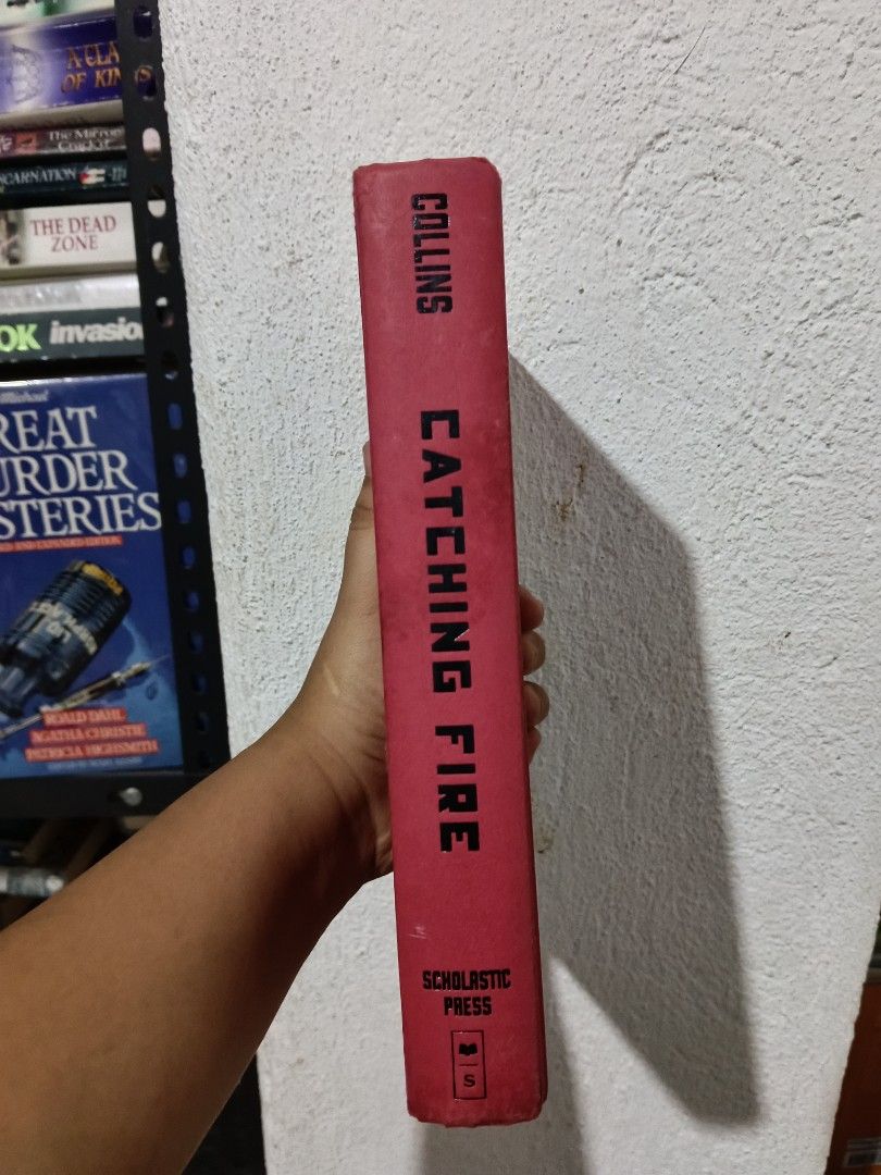 Catching Fire; Hunger Games( Paperback/Hardcover) (Category: Storybooks) located in Luna. Submitted by bookmine (Listing ID 1467571755, Image 2). Description: Paperback w/ flaw( Cuts on Cover)-150 hardcover -550 hardcover no dustcover-399.