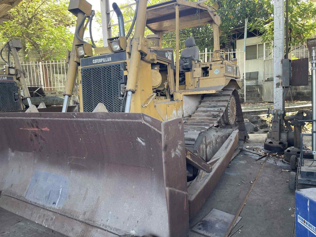 Caterpillar D6R Bulldozer (Category: Construction Tools & Equipment) located in Manila. Submitted by joseph.and.rona (Listing ID 1467504062, Image 1). Description: - Model: Caterpillar D6R XR Bulldozer - Color: Yellow - Mobility: Heavy crawler tracks on both sides for superior traction - Equipment: Large front-mounted blade and rear ripper attachment - Operator Area: Open-air cab setup with comfortable operator seat - Condition: Used heavy machin