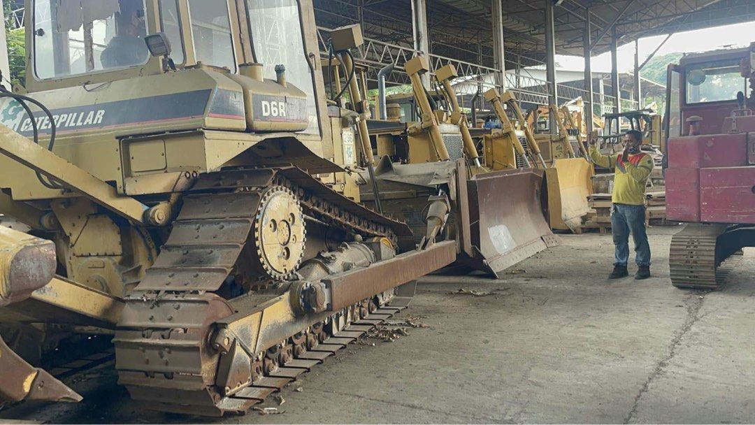 Caterpillar D6R Bulldozer (Category: Construction Tools & Equipment) located in Manila. Submitted by joseph.and.rona (Listing ID 1467504062, Image 2). Description: - Model: Caterpillar D6R XR Bulldozer - Color: Yellow - Mobility: Heavy crawler tracks on both sides for superior traction - Equipment: Large front-mounted blade and rear ripper attachment - Operator Area: Open-air cab setup with comfortable operator seat - Condition: Used heavy machin
