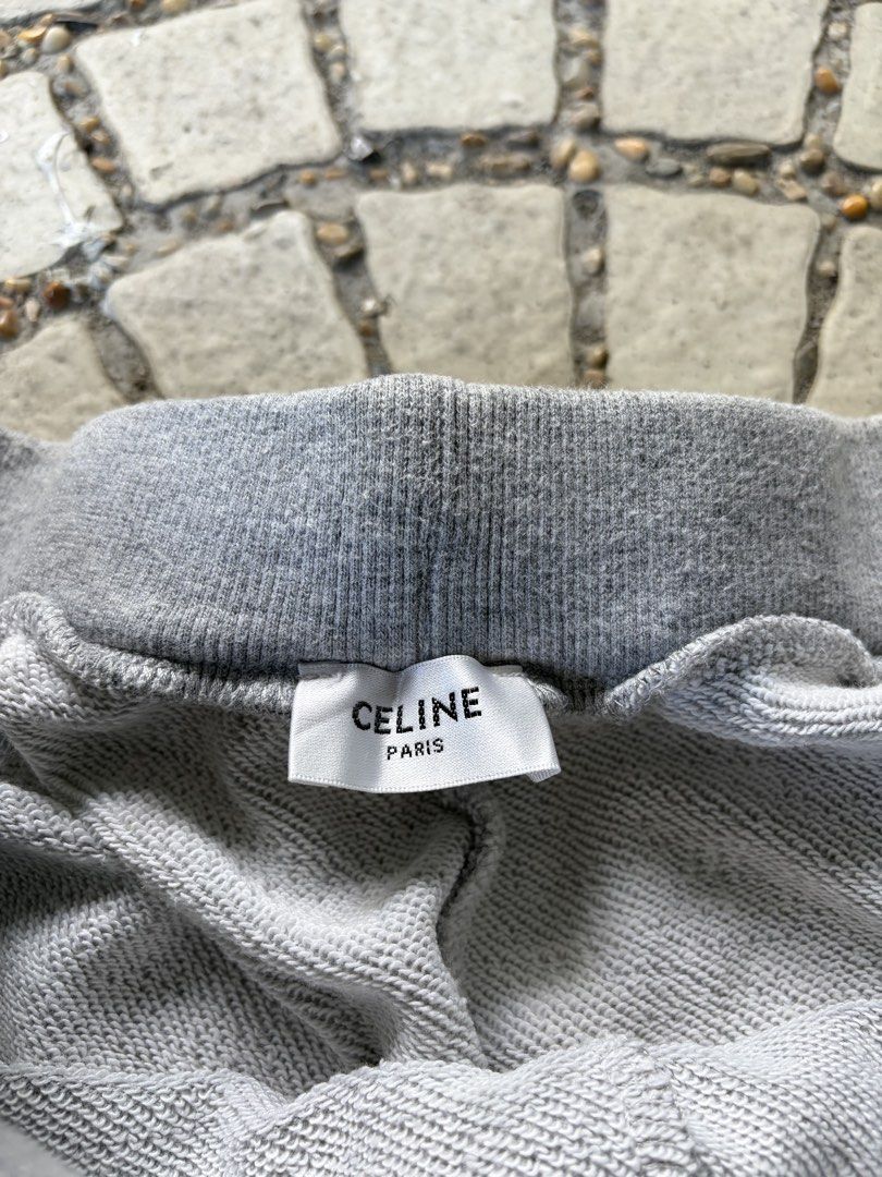 Celine Grey Sweatshorts with Navy C Patch (Category: Shorts) located in Iloilo. Submitted by raeshel (Listing ID 1467485844, Image 2). Description: Authentic Celine grey fleece sweatshorts featuring a navy blue 'C' applique, adjustable drawstrings, and a raw hem..
