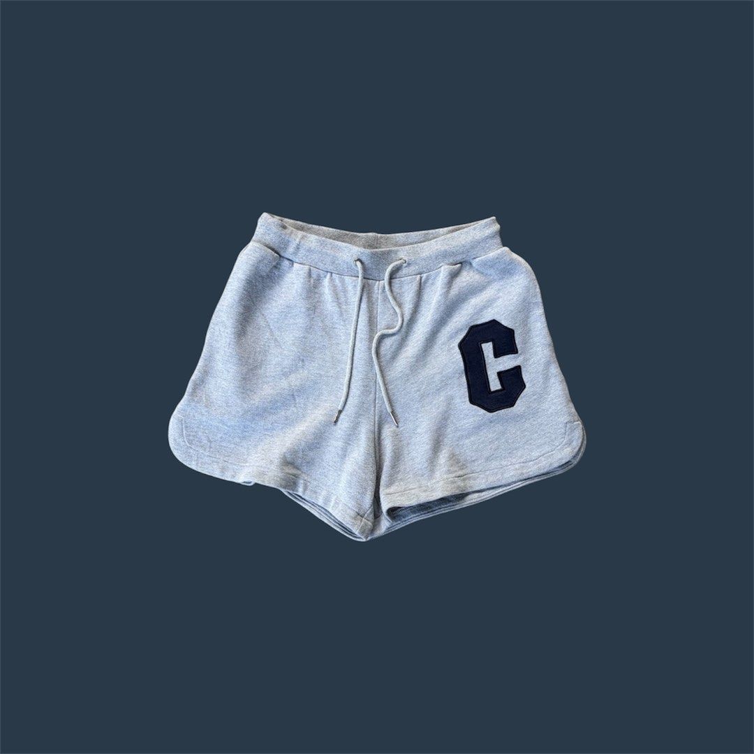 Celine Grey Sweatshorts with Navy C Patch (Category: Shorts) located in Iloilo. Submitted by raeshel (Listing ID 1467485844, Image 1). Description: Authentic Celine grey fleece sweatshorts featuring a navy blue 'C' applique, adjustable drawstrings, and a raw hem..