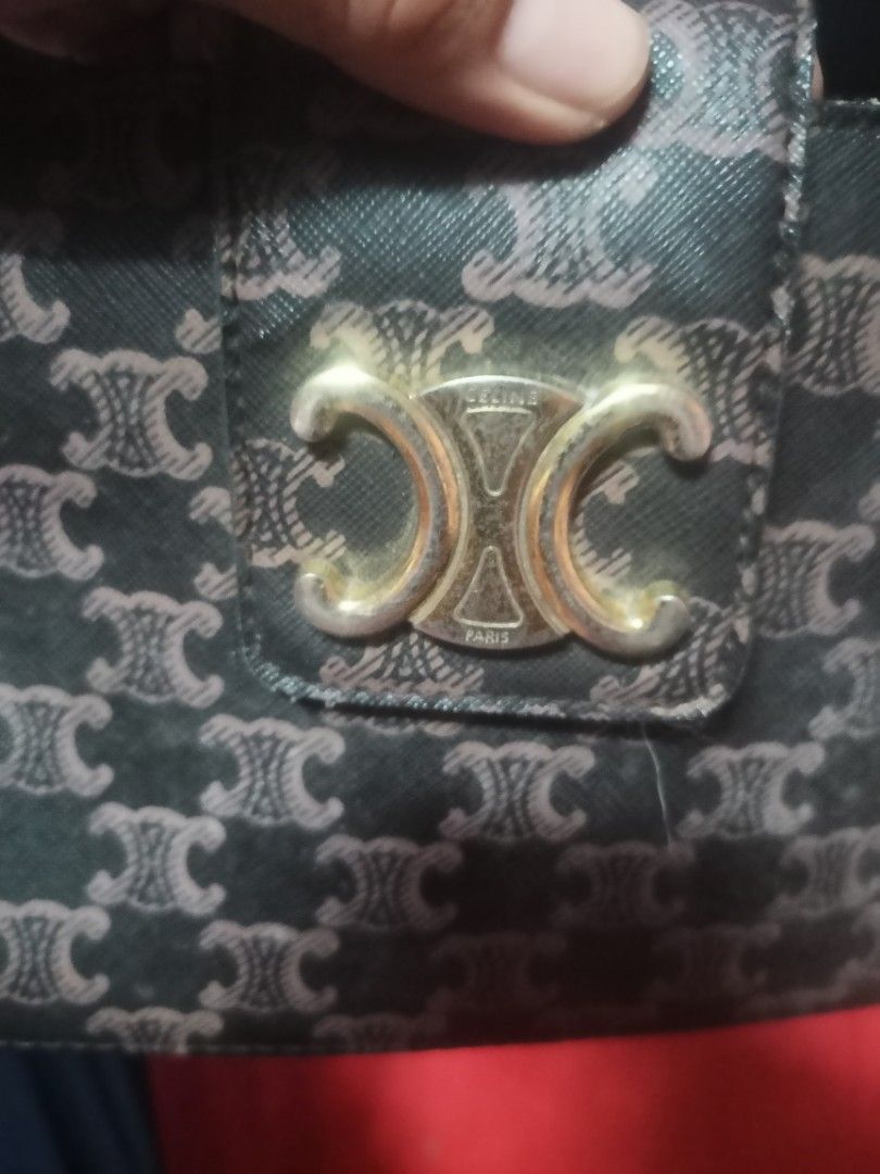 Celine Triomphe Canvas Shoulder Bag Brown (Category: Luxury Bags & Wallets) located in Cavite. Submitted by ronniel0943882 (Listing ID 1467391106, Image 2). Description: Celine shoulder bag with iconic Triomphe monogram print - Brown canvas body paired with elegant tan leather strap - Secure top zipper closure with a stylish gold-tone front flap clasp - Vibrant yellow fabric lining featuring an interior logo patch and tag - Compact size, perfect 