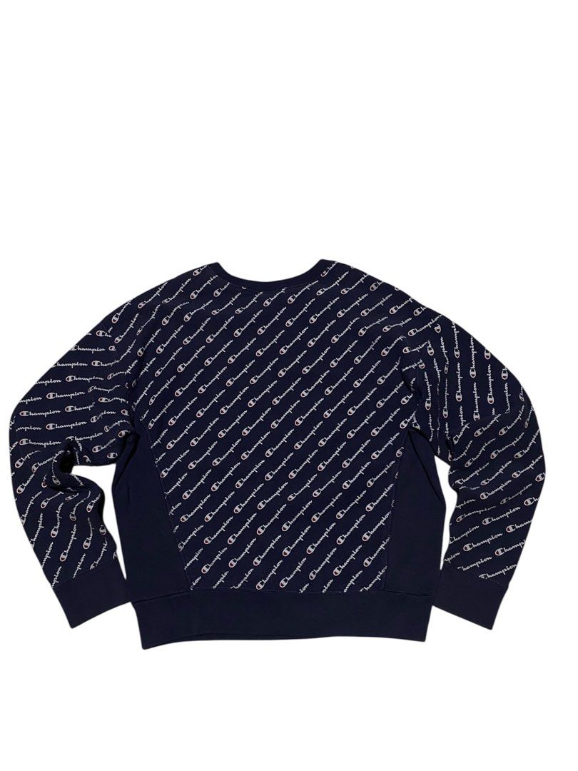 Champion aop sweatshirt (Category: Hoodies) located in Lipa City. Submitted by inglowetrust (Listing ID 1467401714, Image 2). Description: Champion Sweatshirt Size: LARGE Width: 21 Length: 26 Type: Navy blue crewneck sweatshirt Print: All-over “Champion” logo pattern .