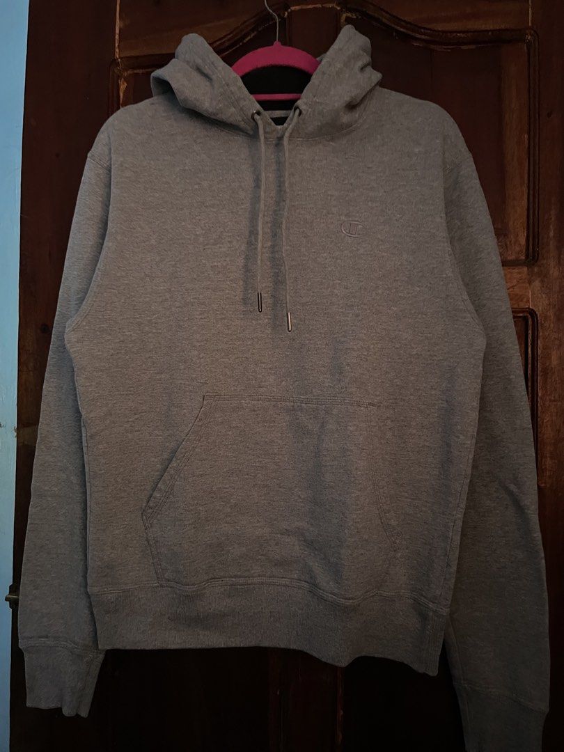 Champion Grey Authentic Hoodie Size S (Category: Hoodies) located in Davao. Submitted by vin.my (Listing ID 1467372312, Image 1). Description: Grey Champion hoodie with drawstring hood and front pouch pocket. Small embroidered Champion logo on the left chest and classic patch logo on the left sleeve cuff. Made in Honduras. Size small tag attached. Cotton blend fabric, warm and comfortable for daily wear..