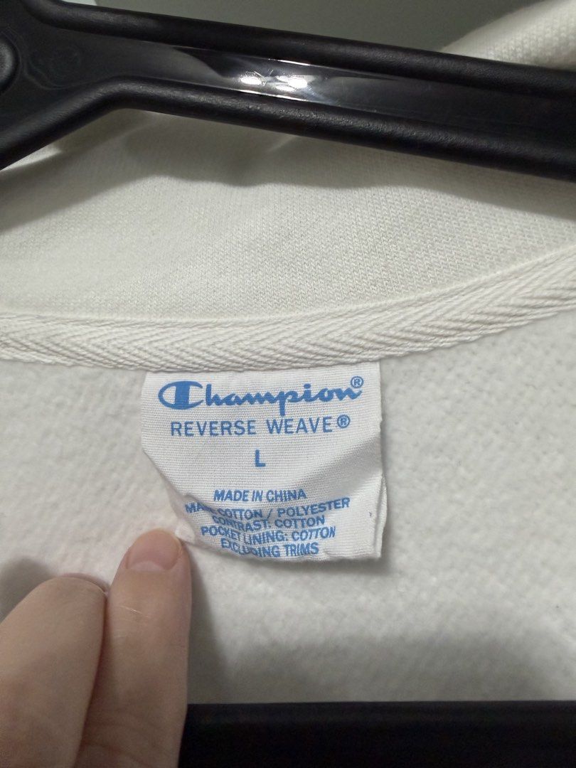 Champion Reverse Weave Quarter Zip Sweatshirt White (Category: Coats, Jackets and Outerwear) located in Quezon City. Submitted by ja_preloved4u (Listing ID 1467492511, Image 2). Description: - Brand: Champion - Style: Reverse Weave pullover with quarter zip and high collar - Size: Large - Color: White - Details: Adjustable drawstrings on ribbed hem, iconic embroidered logo patch on left chest - Material: Cotton and polyester blend.