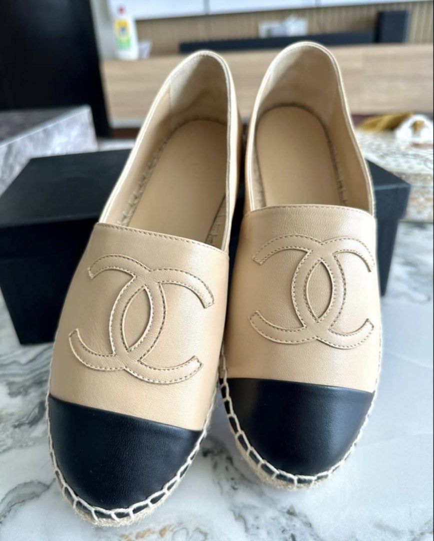 Chanel Beige and Black Leather Espadrilles (Category: Flats & Sandals) located in Tarlac. Submitted by fashionblosom (Listing ID 1467477536, Image 2). Description: -Brandnew Original Chanel -RFS: size too small - Authentic Chanel slip-on espadrilles in classic beige leather with contrasting black cap toes - Features iconic large stitched CC logos on the front and traditional jute trim midsole - Complete full set: includes original branded box, du