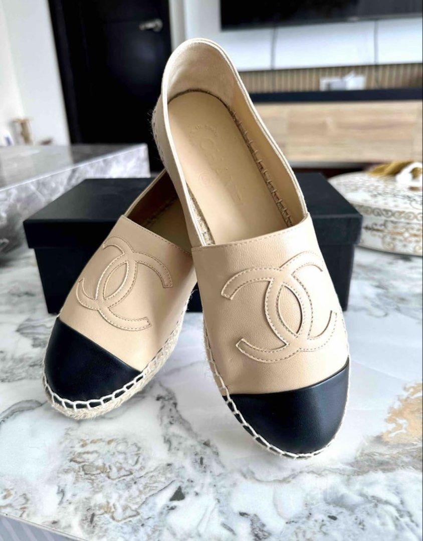 Chanel Beige and Black Leather Espadrilles (Category: Flats & Sandals) located in Tarlac. Submitted by fashionblosom (Listing ID 1467477536, Image 1). Description: -Brandnew Original Chanel -RFS: size too small - Authentic Chanel slip-on espadrilles in classic beige leather with contrasting black cap toes - Features iconic large stitched CC logos on the front and traditional jute trim midsole - Complete full set: includes original branded box, du
