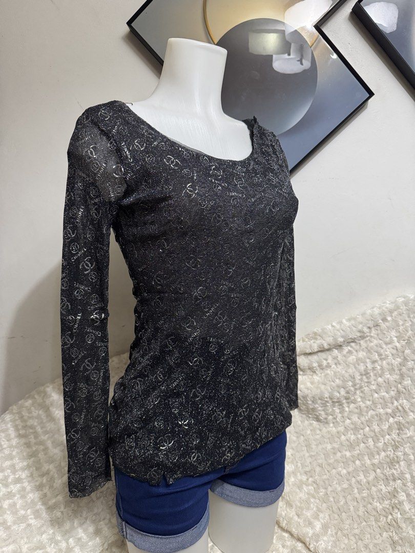 Chanel Black Glitter Long Sleeve Top (Category: Longsleeves) located in Marikina City. Submitted by lorradel (Listing ID 1467515716, Image 2). Description: - Color: Black with all-over CC logo pattern - Fabric: Lightweight sheer material with shimmery silver sparkle - Fit: Fitted silhouette with a classic scoop neckline - MAY HAVE some washable stains (hindi maiiwasan) needs washing; had been stored - mannequin size 34-26-34 - mannequin’s shoulde