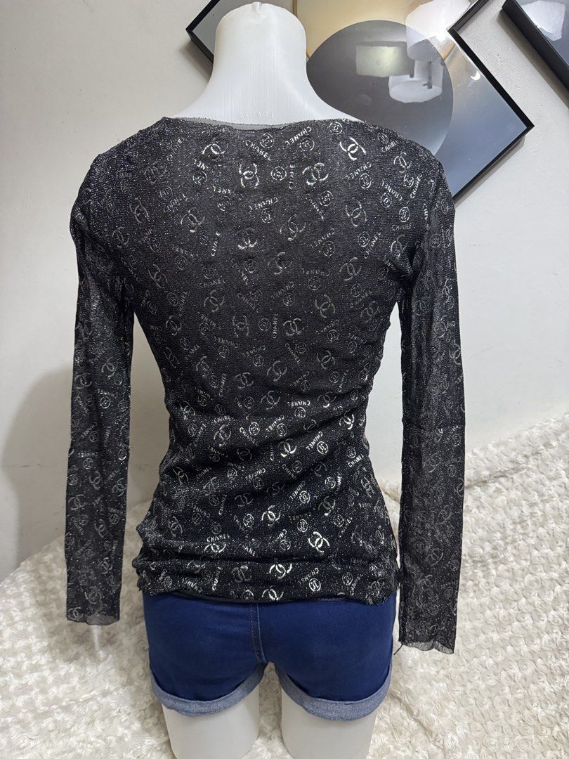 Chanel Black Glitter Long Sleeve Top (Category: Longsleeves) located in Marikina City. Submitted by lorradel (Listing ID 1467515716, Image 3). Description: - Color: Black with all-over CC logo pattern - Fabric: Lightweight sheer material with shimmery silver sparkle - Fit: Fitted silhouette with a classic scoop neckline - MAY HAVE some washable stains (hindi maiiwasan) needs washing; had been stored - mannequin size 34-26-34 - mannequin’s shoulde