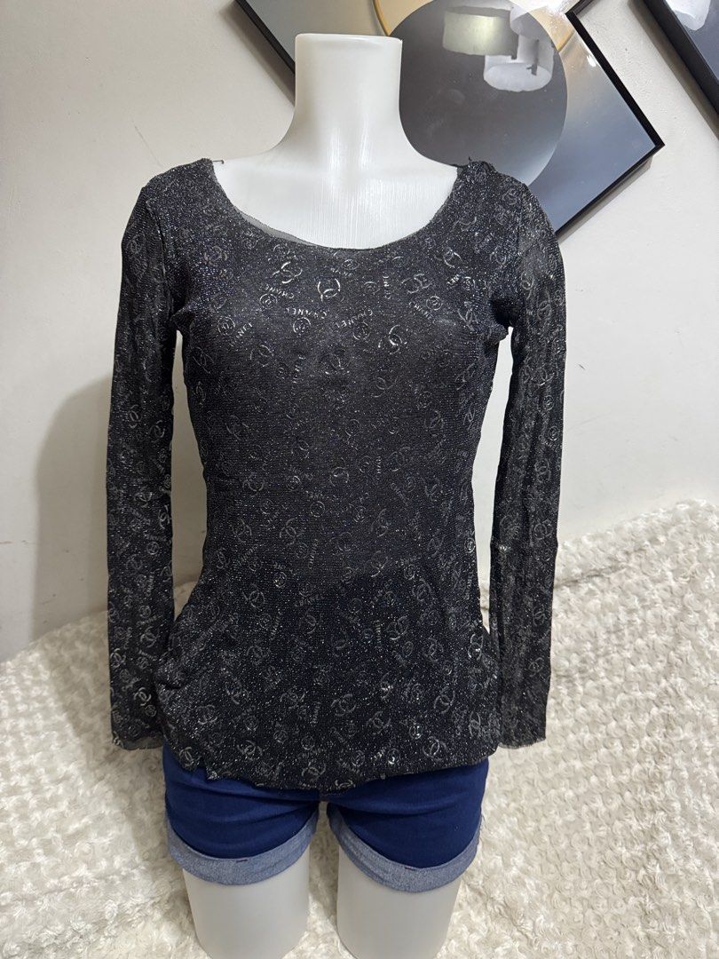 Chanel Black Glitter Long Sleeve Top (Category: Longsleeves) located in Marikina City. Submitted by lorradel (Listing ID 1467515716, Image 1). Description: - Color: Black with all-over CC logo pattern - Fabric: Lightweight sheer material with shimmery silver sparkle - Fit: Fitted silhouette with a classic scoop neckline - MAY HAVE some washable stains (hindi maiiwasan) needs washing; had been stored - mannequin size 34-26-34 - mannequin’s shoulde