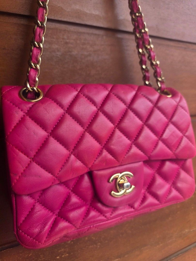 Chanel Pink Quilted Leather Shoulder Bag (Category: Luxury Bags & Wallets) located in Lemery. Submitted by venus23 (Listing ID 1467380774, Image 2). Description: - Brand: Chanel - Style: Quilted leather shoulder bag - Color: Bright pink - Hardware: Gold-tone - Strap: Interwoven pink leather and gold chain - Closure: Classic CC turnlock front flap - Exterior: Convenient back slip pocket with a structured silhouette.