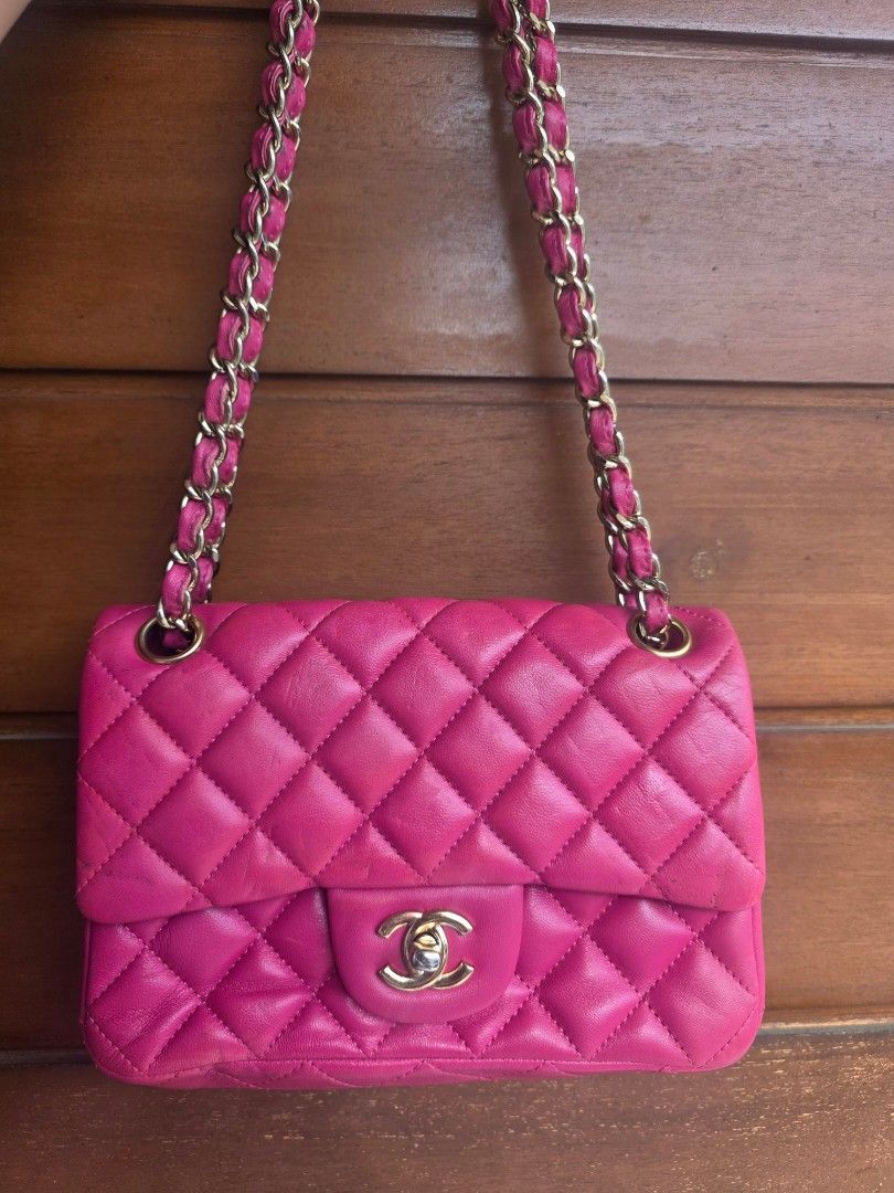 Chanel Pink Quilted Leather Shoulder Bag (Category: Luxury Bags & Wallets) located in Lemery. Submitted by venus23 (Listing ID 1467380774, Image 1). Description: - Brand: Chanel - Style: Quilted leather shoulder bag - Color: Bright pink - Hardware: Gold-tone - Strap: Interwoven pink leather and gold chain - Closure: Classic CC turnlock front flap - Exterior: Convenient back slip pocket with a structured silhouette.