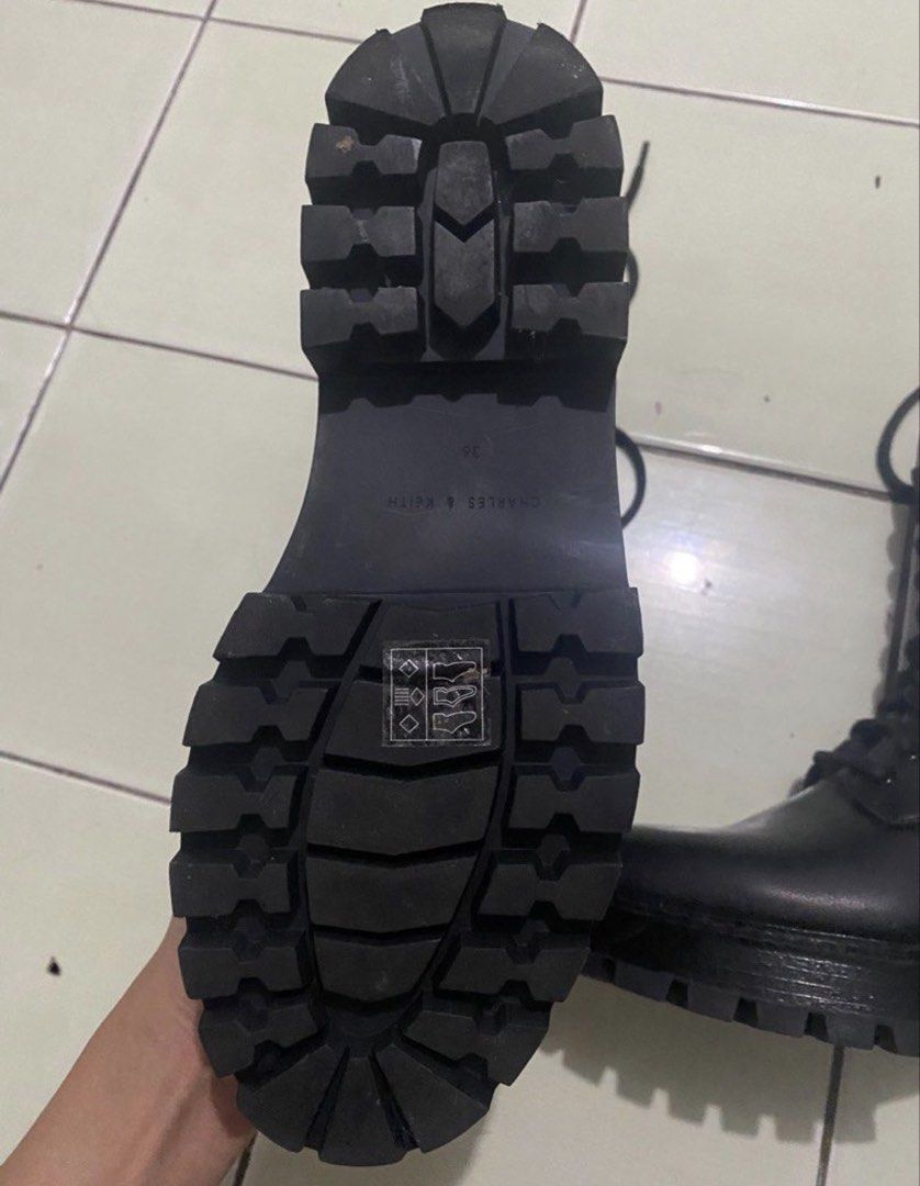 Charles & Keith Black Combat Boots Size 36 (Category: Boots) located in Manila. Submitted by xy.ly (Listing ID 1467522829, Image 3). Description: - Brand: Charles & Keith - Size: 36 - original price (8k) - Color: Matte black finish - Design: Lace-up front with convenient inner side zipper and back pull tab - Sole: Chunky lug sole, sturdy heel, and clean tread with minimal wear - Condition: Solid construction and well-maintained.